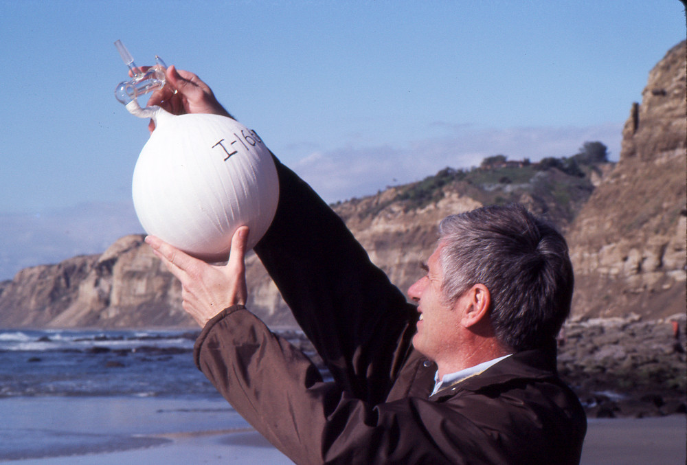 C.D. Keeling sampling air in La Jolla with a flask